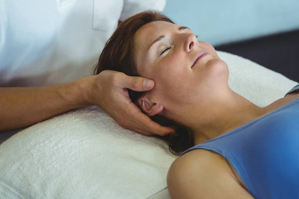 physiotherapist-giving-head-massage-to-a