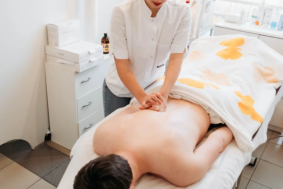 woman-s-hands-massaging-man-s-back-masseuse-chir-2022-11-14-19-26-45-utc